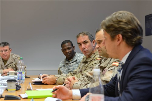 Members of the Spanish Joint Staff and U.S. Africa Command participate in a discussion at the AFRICOM Multinational Cooperation Center in Stuttgart, Germany, Dec. 2, 2015.