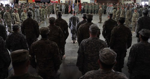 Soldiers assigned to Combined Joint Task Force-Horn of Africa are honored at a patching ceremony at Camp Lemonnier, Djibouti, Nov. 28, 2015. More than 150 soldiers were awarded their combat patch during the ceremony which has roots dating back to 1918. (U.S. Air Force photo by Tech. Sgt. Dan DeCook)