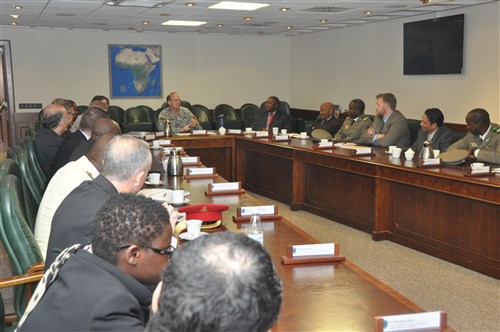 The visiting officers listen to a briefer during their visit to AFRICOM Oct. 29. Thirteen military officers from nine African nations visited the U.S. Africa Command headquarters as part of their participation in the Program on Applied Security Studies, the flagship course offered at the George C. Marshall Center for Strategic Studies in Garmisch, Germany. 