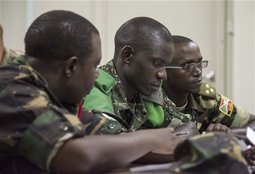 Military members from Tanzania, Uganda and Burundi prepare for simulated interaction with local media during the Public Information Officer Conference, hosted by Combined Joint Task Force-Horn of Africa, at Camp Lemonnier, Djibouti, Nov. 4, 2015.