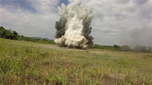 An explosion rips the ground apart during an explosive ordnance disposal demonstration between Marines with SPMAGTF Crisis Response-Africa and soldiers with the Ugandan People’s Defense Force in Camp Singo, Uganda, Nov. 13, 2014. Marines and Sailors with SPMAGTF Crisis Response-Africa were in Uganda from Oct. - Dec., training alongside the UPDF, focusing on infantry tactics, countering IEDs, and logistics. (Courtesy Photo)