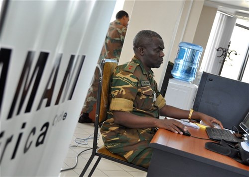 ADDIS ABABA, Ethiopia - Zambian Lieutenant Colonel Jimmy Chidemba Mbao, plans officer, works on exercise scenarios during the Amani Africa command post exercise October 26, 2010 in Addis Ababa, Ethiopia. Aimed at determining and furthering the African Defense Force's operational capability, the 10-day exercise involves more than 120 African military components and police forces from North, East, West, South and Central African regions, along with and 75 civilians and various European Union partners. (AFRICOM photo by Staff Sergeant Amanda McCarty)