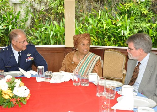 MONROVIA, Liberia - Liberian President Ellen Johnson-Sirleaf (center), welcomes Major General Thomas Cutler, Michigan National Guard adjutant general (left) and Ambassador J. Anthony Holmes, AFRICOM's deputy to the commander for civil-military activities (right) to her residence for a breakfast meeting. Johnson-Sirleaf received Michigan National Guard and U.S. Africa Command leadership delegations in Monrovia October 26, 2010. They discussed the new State Partnership Program with Michigan and Liberia and ongoing U.S. security force assistance efforts in this West African nation. (US Africa Command photo by Kenneth Fidler)