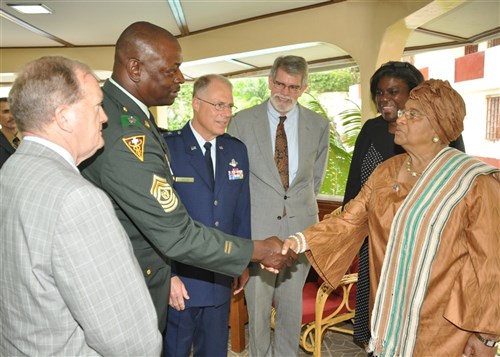 MONROVIA, Liberia - Liberian President Ellen Johnson-Sirleaf (right), greets Michigan National Guard and U.S. Africa Command leadership delegations at her residence in Monrovia October 26, 2010. From left to right:  James Hart, deputy director for programs, U.S. Africa Command; Michigan National Guard Command Sergeant Major Delbert Husband; Michigan Adjutant General Major General Thomas Cutler; Ambassador J. Anthony Holmes, AFRICOM's deputy to the commander for civil-military activities; and Ambassador Linda Thomas-Greenfield, U.S. Ambassador to Liberia. (US Africa Command photo by Kenneth Fidler)