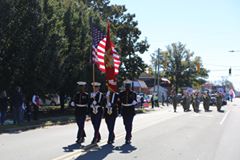 '161105-M-ZF591-004

The Marine Corps Color Guard leads a column of floats and displays during the 96th annual Veterans Day Parade in Warsaw, N.C., Nov. 5, 2016. The Warsaw Veterans Day Parade has been adopted as the official Veterans Parade in the state of North Carolina by the N.C. General Assembly as of Jun. 24, 2016.  The Marines assigned to the color guard are attached to Deployment Processing Command Reserve Unit East. (U.S. Marine Corps photo by Cpl. Shannon Kroening)'