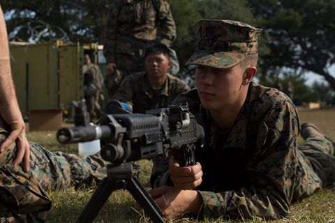 'Pfc. Caleb Lebrun listens to an instructor as they review the steps of operating a M240B medium machine gun during a command post exercise at Bogue Marine Corps Auxiliary Landing Field, N.C., Nov. 3, 2016.'