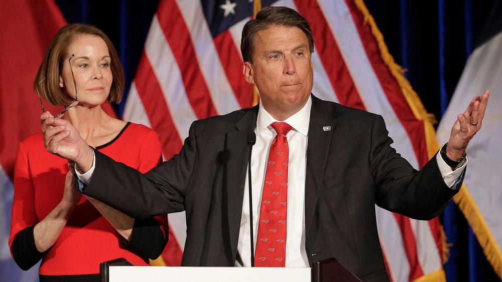 North Carolina Gov. Pat McCrory speaks to supporters as his wife Ann McCrory listens (Chuck Barton/Associated Press)