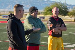 'Officers of Marine Wing Support Squadron 374 take a break during half time of the MWSS-374 Turkey Bowl at Felix Field aboard the Marine Corps Air Ground Combat Center, Twentynine Palms, Calif., Nov. 22, 2016. MWSS-374 held the Turkey Bowl to build camaraderie within the senior leadership. (Official Marine Corps photo by Lance Cpl. Dave Flores/Released)'