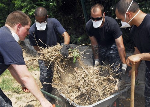 DRAGUIGNAN, France &mdash; Sailors assigned to Oliver Hazard Perry-class frigate USS Taylor (FFG 50) remove debris July 5 left behind after a major flash flood struck Draguignan, France. Taylor is on a scheduled deployment in the U.S. 6th Fleet area of responsibility. (U.S. Navy photo by Ensign Lynn Bovard)