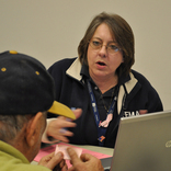 Bridgeport, Conn., Nov. 3, 2012 -- Applicant Services Specialist Alisa Lee Gollotte explains the application process to a disaster survivor.  FEMA is opening Disaster Recovery Centers in the affected areas to assist applicants and answer their questions.   Photo by Marilee Caliendo/FEMA