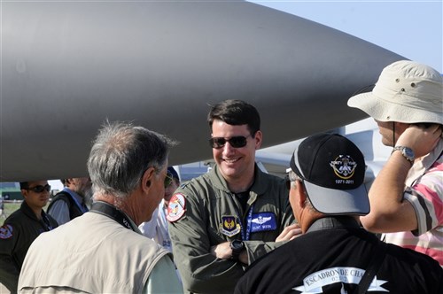 Lt. Col. Clint Mixon, a weapons systems officer from the 492nd Fighter Squadron at Royal Air Force Lakenheath, England, explains the capabilities of the F-15E Strike Eagle on display Aug. 16, 2011, at the Moscow International Aviation and Space Salon, or MAKS, at Zhukovsky Airfield. About 100 crew members from U.S. and Europe-based units are participating in the show through Aug. 22. (U.S. Air Force photo/Master Sgt. Kelley J. Stewart)
