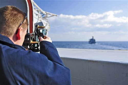 MEDITERRANEAN SEA, (March. 15, 2011) -- Quartermaster 2nd Class Jesse Glover uses a statometer to measure the distance from the Arleigh Burke-class guided-missile destroyer USS Barry (DDG 52) to the Military Sealift Command fleet replenishment oiler USNS Kanawha (T-AO 196) prior to a replenishment at sea.  Barry is on a routine deployment conducting maritime security operations and theater security cooperation efforts in the U.S. 6th Fleet area of responsibility. (U.S. Navy photo by Mass Communication Specialist 3rd Class Jonathan Sunderman/Released)