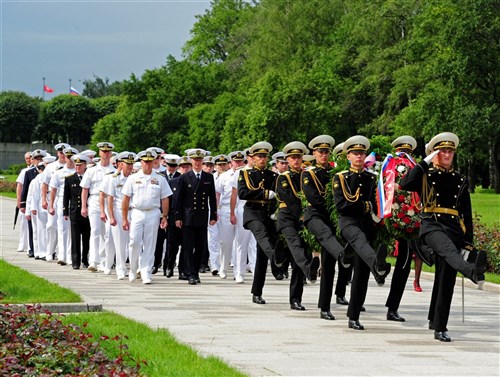 ST. PETERSBURG, Russia - Sailors from Fench naval vessel De Grasse (D612), Russian naval vessel Yaroslav Mudriy (727), British navy vessel HMS York (90), guided-missile cruiser USS Normandy (CG 60) and U.S. Naval Forces Europe-Africa, walk in formation during a wreath-laying ceremony held at the Piskariovskoye Memorial Cemetery during Exercise FRUKUS 2012. FRUKUS is an annual exercise aimed at improving maritime security through an open dialogue and increased training between the navies of France, Russia, United Kingdom and United States.