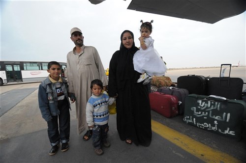 DJERBA ZARIS, TUNISIA (March 15, 2011) -- An Egyptian family prepares for a fight from Djerba Zarzis Airport in Tunisia to Cairo, Egypt, aboard a U.S. Air Force C-130J. These Egyptian citizens are among tens of thousands who have fled conflict in Libya to Tunisia, where a humanitarian crisis is unfolding. This C-130J, flown by the 37th Airlift Squadron from Ramstein Air Base, Germany, is part of a contingent of aircraft from the 37th AS and the 26th U.S. Marine Expeditionary Unit that are transporting the evacuees home. The airlift is part of a broader U.S. government effort led by the Department of State to assist with the crisis. (U.S. Army photo by Staff Sgt. Brendan Stephens/Released)