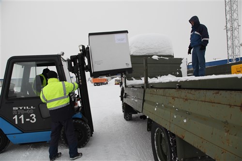 Sarajevo Airport personnel assist with downloading equipment that was delivered to Sarajevo, Bosnia and Herzegovina from Ramstein Air Base, Germany, Feb. 12, 2012. The delivery was part of a military-to-military exchange between BiH and U.S. Forces.