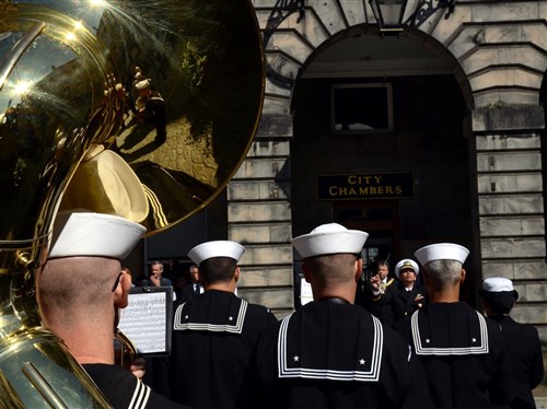 Musicians with the U.S. Naval Forces Europe-Africa Band perform a concert for the Lord Lieutenant and Lord Provost of the City of Edinburgh, the Right Honorable David Wilson, outside the city chambers building, July 30. The CNE band is in Edinburgh to perform in the Royal Edinburgh Military Tattoo with musicians, dancers and bagpipers from around the world coming to perform in the month long show.