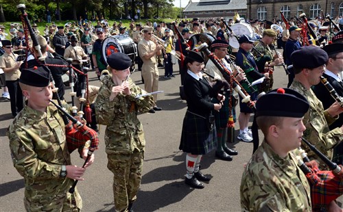 Musicians from the many international military and civilian bands rehearse a song July 31 for the mass military band ensemble for the Royal Edinburgh Military Tattoo. This military tattoo, which runs Aug. 3-25, brings together musicians, dancers and bagpipers from around the world to perform in Europe’s most prestigious military tattoo. 
