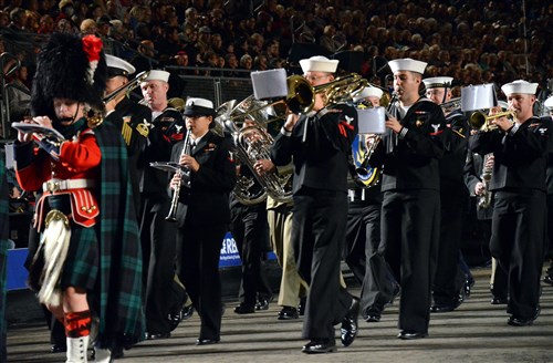 U.S. Naval Forces Europe Band musicians and musicians from Scotland and Australia march out during the finale of the Royal Edinburgh Military Tattoo's opening night Aug. 3. The month long tattoo runs through Aug. 25 and brings together musicians, dancers and bagpipers from around the world to perform in Europe’s most prestigious military tattoo.