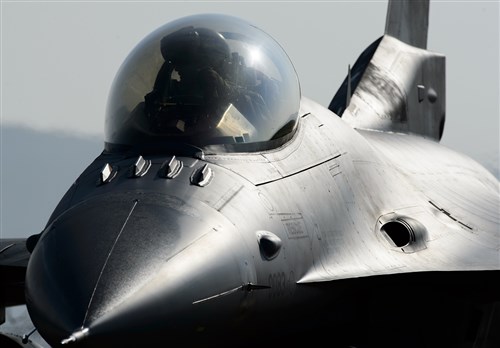 A 480th Fighter Squadron F-16 Fighting Falcon aircraft is readied for flight during the first goes of exercise Dacian Warhawk at Campia Turzii, Romania, March 16, 2015. The exercise provides an opportunity for both pilots and support Airmen to work together with Romanian Airmen to strengthen the relationship between nations. (U.S. Air Force photo/Staff Sgt. Armando A. Schwier-Morales)