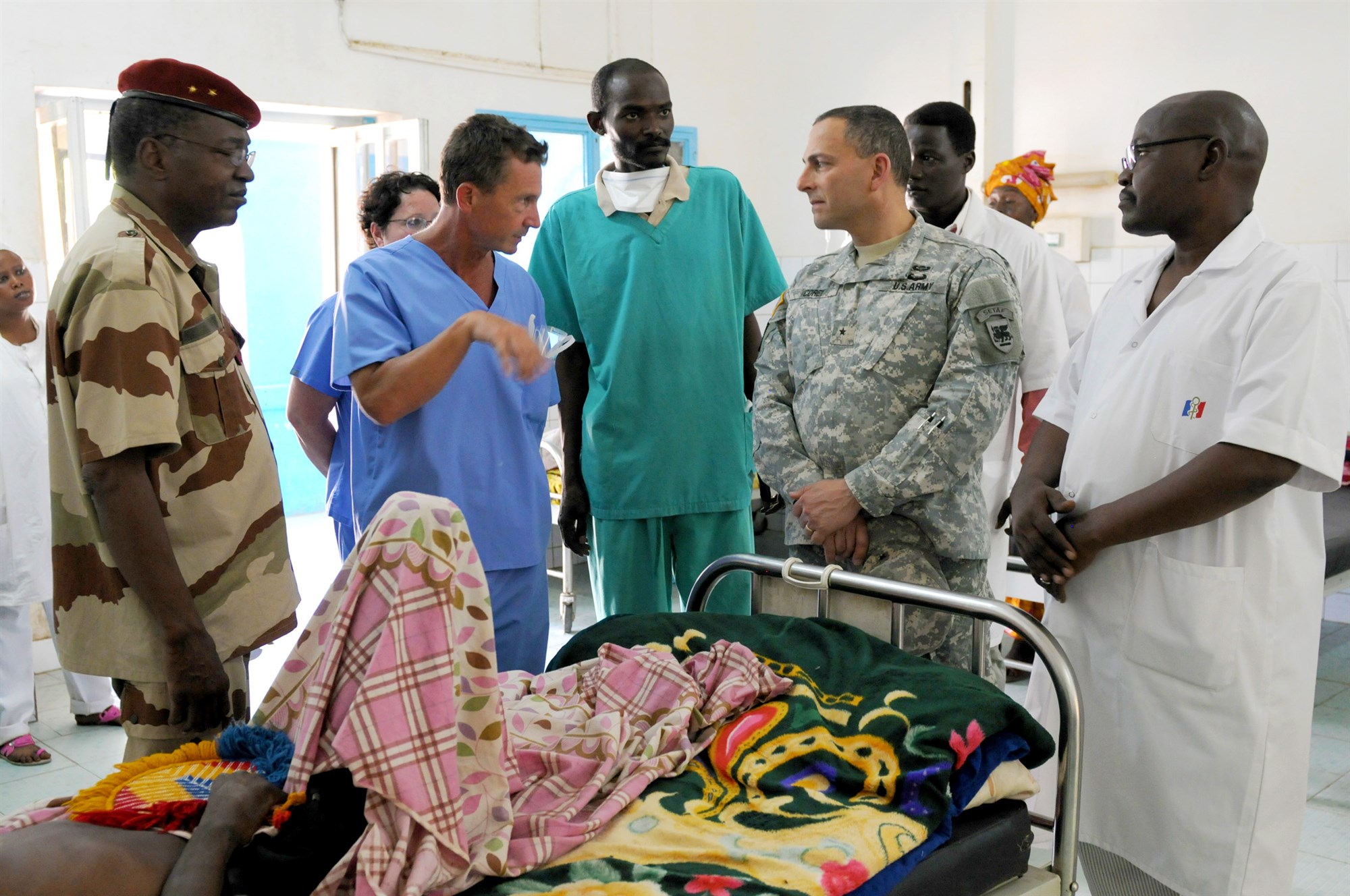 Brig. Gen. Peter Corey, the deputy commanding general of U.S. Army Africa, walks through the patients’ ward at the Hospital Militaire D’Instruction in N’Djamena, Chad, April 23. While at HMI, Corey visited the labs, patient wards, and operating rooms. He also observed a surgery and checked in with the U.S. Army Soldiers participating in Medical Readiness and Training Exercise 15-3. The Soldiers have been in Chad for nearly two weeks working alongside Chadian hospital staff conducting consultations with patients, performing and assisting in surgeries, and assessing and treating trauma patients. (U.S. Army Africa photo by Staff Sgt. Andrea Merritt)