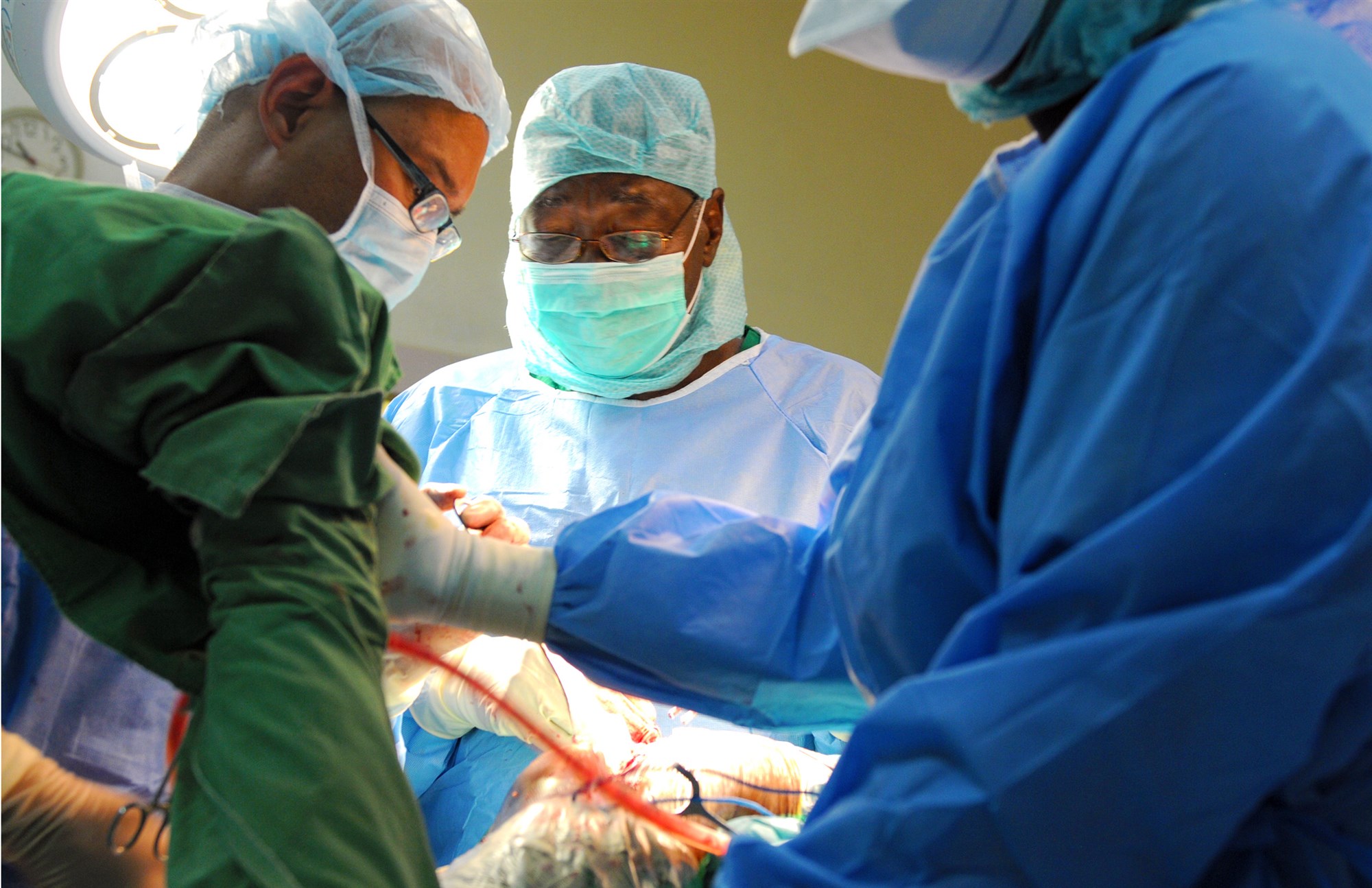 Chadian Army Gen. Djetodjide Tetimian, the director of the Hospital Militaire D’Instruction, performs a hemiarthroplasty procedure on a patient with a fractured hip April 22.  (U.S. Army Africa photo by Staff Sgt. Andrea Merritt)