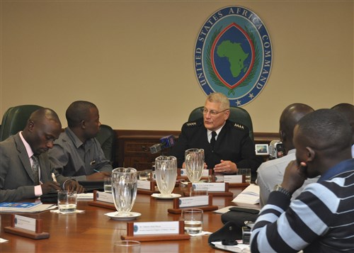 STUTTGART, Germany - General Carter F. Ham, commander of U.S. Africa Command, meets with a delegation of Ugandan media, July 19, 2011. Seven journalists from Kampala, Uganda, representing four newspapers and three TV stations, visited AFRICOM headquarters to meet with senior military leaders, visit military and local news organizations, and receive briefings on a wide range of AFRICOM programs. (AFRICOM photo by Nancy Hudson)