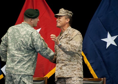 STUTTGART, Germany - U.S. Special Operations Command Africa Commander Brigadier General Christopher Haas shakes hands with his successor Rear Admiral Brian Losey during a change-of-command ceremony on Kelley Barracks June 21, 2011. Losey was previously the Combined Joint Task Force - Horn of Africa commander. (Photo by Martin Greeson)