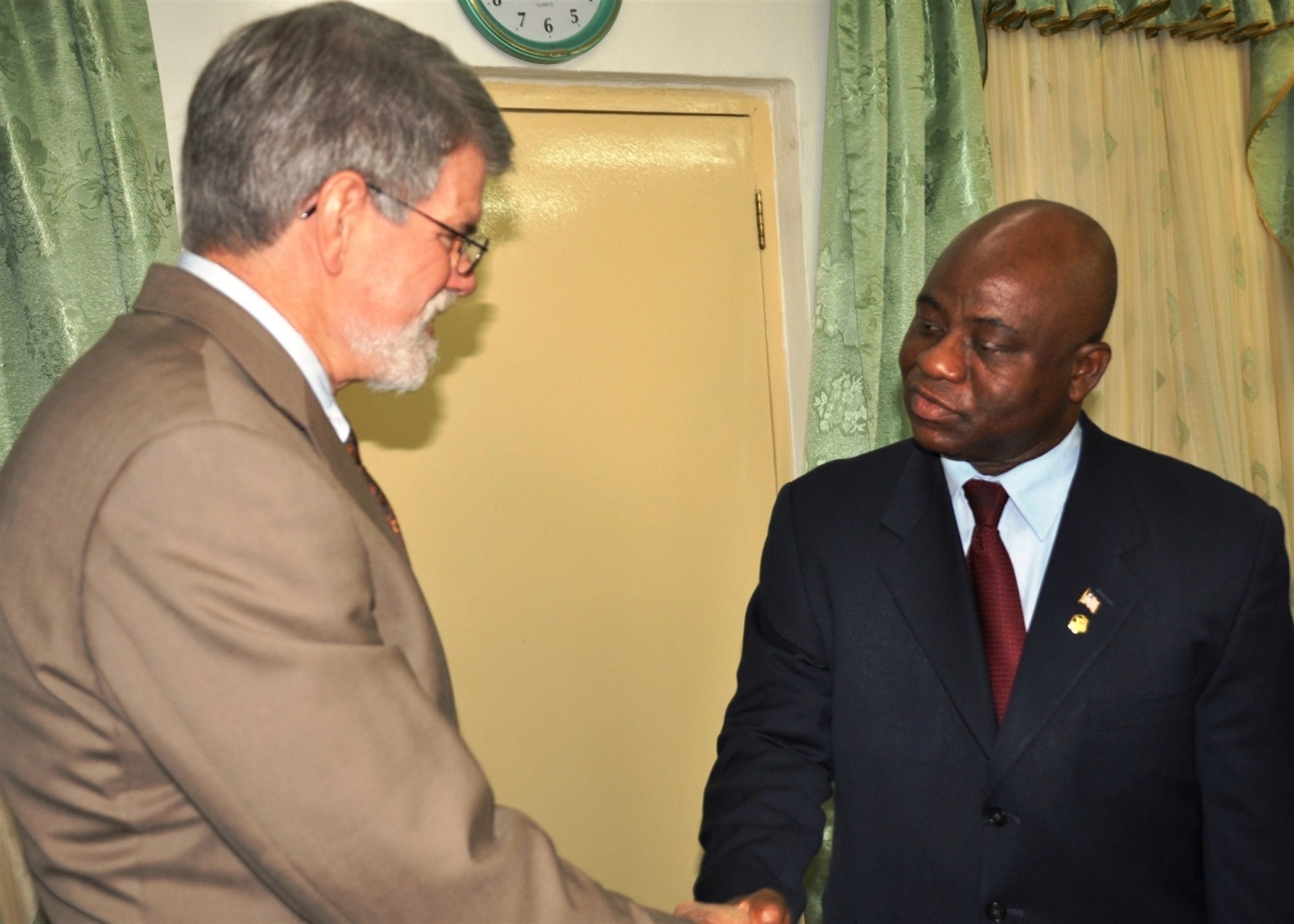 MONROVIA, Liberia - Liberian Minister of National Defense Brownie J. Samukai Jr. welcomes Ambassador J. Anthony Holmes, deputy to the commander for civil-military activities, U.S. Africa Command (AFRICOM), to Liberia on October 25, 2010. Holmes is in Monrovia on a three-day visit to gain insight into the security assistance activities AFRICOM conducts in this West Africa nation. Visiting Liberia for the first time, he met with soldiers of the Armed Forces of Liberia (AFL) and the U.S. military mentors who work to advise the AFL, a two-year-old force of about 2,000 soldiers.  The U.S. has been the largest contributor supporting the AFL's continued progress to build and maintain a professional military since it was completely demobilized in 2005. (US Africa Command photo by Kenneth Fidler)