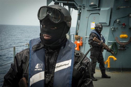  Ivory Coast boarding team members establish perimeter security aboard the German navy vessel FGS Brandenburg (F215) March 21, 2015 during an illegal fishing training scenario as part of Obangame Express 2015. Obangame Express is a U.S. Africa Command-sponsored multinational maritime exercise designed to increase maritime safety and security in the Gulf of Guinea. (U.S. Army photo by Specialist Raul Pacheco/Released)