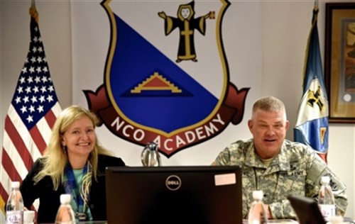 Erica J. Barks-Ruggles, U.S. ambassador to the Republic of Rwanda and U.S. Army Brig. Gen. Kenneth Moore, U.S. Army Africa deputy commanding general, attend a briefing at the 7th noncommissioned officer academy during a tour of U.S. Army Joint Multination Training Command facilities in Grafenwoehr, Germany, Oct. 21-22. (U.S. Army Africa photo by Sarah Tate, JMTC Public Affairs/Released)