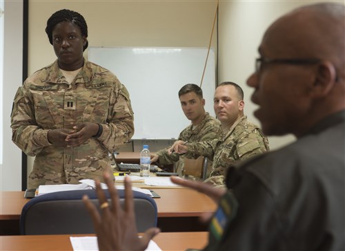 U.S. Army Capt. Morgan Shepard, Combined Joint Task Force-Horn of Africa Public Information officer, listens as Rwanda Defense Force Army Capt. Edouard Turatsinze, Ministry of Defense Public Relations and Communications officer, discusses a topic Feb. 2, 2016, at RDF headquarters, Kigali, Rwanda. The interaction between CJTF-HOA and RDF personnel was the first of four phases in plan to increase interoperability between CJTF-HOA, RDF and Rwanda Peace Academy, supporting regional training efforts for peacekeeping operations and enabling the impact of those partners to grow. (U.S. Air Force photo by Senior Airman Peter Thompson)