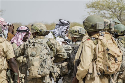 Soldiers from Burkina Faso and the U.S. interact with role players during a situational training exercise during Exercise Western Accord 14, June 24. Exercise Western Accord 14 is a U.S. Army Africa-hosted annual joint training and partnership exercise between the United States and Economic Community of West Africa States, which is designed to increase interoperability between military forces and ensure the common ability to conduct peace operations throughout Western Africa.