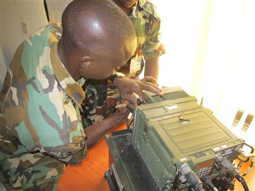 ABUJA, Nigeria - Soldiers from the Economic Community of West African States (ECOWAS) Combat Forces Signal Squadron assemble a radio set as part of exercise Africa Endeavor 2011, July 11, 2011.  Africa Endeavor is a U.S. Africa Command-sponsored initiative focusing on interoperability and information sharing among African partner nations. AE 2011 takes place simultaneously in Banjul, The Gambia; Abuja, Nigeria; and Addis Abba, Ethiopia.  (AFRICOM Photo by Lieutenant Colonel Steven Lamb)