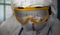 A health care worker attending the Department of Defense Ebola Treatment Training Team’s class at the National Police Training Academy, Paynesville, Liberia, recovers after encountering an expert patient trainer who simulated a suspected Ebola patient who becomes confused and aggressive during his stay at an Ebola treatment unit.