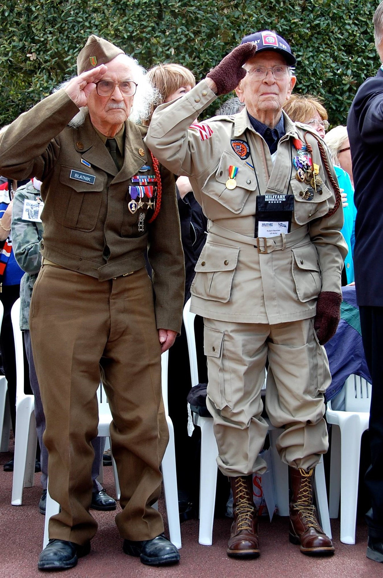 World War II veterans salute during the playing of the national anthem during the D-Day commemoration ceremony at the Normandy American Cemetery in Colleville-sur-mer, France, June 6, 2013. (photo by Kelli Bland, EUCOM Public Affairs) American Battle Monuments Commission