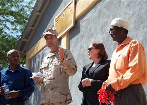 U.S. Navy Rear Admiral Michael Franken, Combined Joint Task Force - Horn of Africa commander, speaks during a school dedication ceremony along with Molly Phee, deputy chief of mission, U.S. Embassy in Ethiopia, and Egei Wabere (right), Gende Gerada Kebele education coordinator, at the Gende Gerada Primary School. Ethiopian and U.S. personnel gathered for a dedication and ribbon-cutting ceremony for a new school house and two latrines in Dire Dawa, Ethiopia, May 22, 2012