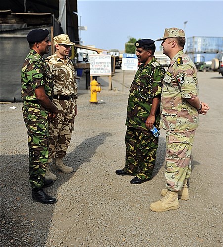 CAMP LEMONNIER, Djibouti (July 5, 2011) - Kenyan Ministry of Defense Muslim Imam (Lieutenant Colonel) Mohammed Ahmed (second from the right) meets with partner nation coalition officers from Combined Joint Task Force - Horn of Africa (CJTF-HOA) before visiting the Muslim prayer tent on Camp Lemonnier, July 5. Ahmed, along with two other Kenyan chaplains, traveled to Camp Lemonnier to receive U.S. professional military chaplaincy familiarization with CJTF-HOA chaplains. (U.S. Army photo by Specialist Michelle C. Lawrence)