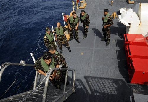 ATLANTIC OCEAN - Moroccan Royal Navy boarding team members from the Moroccan Royal Navy vessel Rais Charkaoui (OPV 320) climb aboard U.S. Coast Guard Cutter Legare (WMEC 912) during a boarding exercise off the coast of Morocco, July 22, 2009. Legare and crew concluded a nine-day law enforcement operation alongside members of the Moroccan Royal Navy, during which they shared boarding tactics and law enforcement procedures. The U.S. Coast Guard, under the direction of Commander, U.S. Naval Forces Europe- Commander, U.S. Naval Forces Africa, conducted law enforcement operations with the Moroccan Royal Navy in a partnership to build a safer, more prosperous sea-trade environment in the region.  (U.S. Coast Guard photo by Fireman Jonathan Chanes)