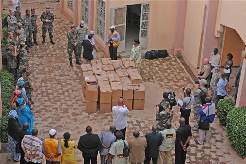 BAMAKO, Mali - U.S. Air Force members from Aviano Air Base, Italy, present boxes of donated clothes, shoes and toys to a local orphanage in Bamako, Mali, on July 16, 2008. The service members deployed to Mali for MEDFLAG 08, a 19-day medical training exercise designed to enhance medical capabilities and readiness for U.S. and African forces. (U.S. Air Force photo by Senior Airman Justin Weaver) 