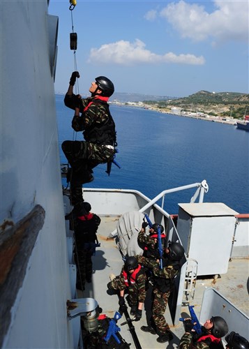 SOUDA BAY, Crete - A Moroccan sailor ascends a boarding ladder while conducting an exercise aboard the Hellenic navy training ship Aris at the NATO Maritime Interdiction Operational Training Center during Phoenix Express 2012 (PE12), May 10. PE12, a multi-national maritime exercise between Southern European, North African and U.S. Naval forces, is designed to improve cooperation among participating nations and help increase safety and security in the Mediterranean Sea. (U.S. Navy photo by Petty Officer 1st Class Brian A. Goyak)