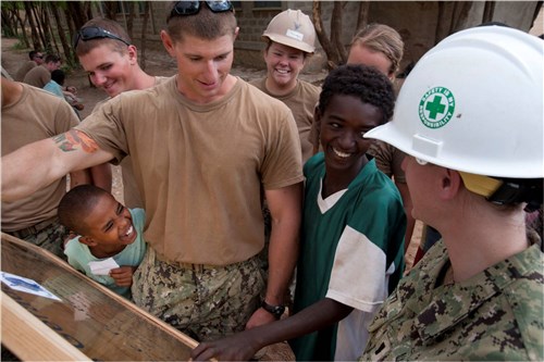 DIRE DAWA, Ethiopia (May 21, 2012) - Ramzii Ahamed (center), a student at Gende Gerada Primary School, practices reading a plaque to U.S. Navy Naval Mobile Construction Battalion Three Seabees here May 21. The plaque was hung outside the newly-constructed school building which was dedicated here during a ribbon cutting ceremony May 22. (U.S. Air Force photo by Tech. Sgt. Ryan Labadens)