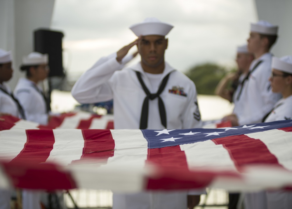 PEARL HARBOR (Dec. 7, 2016) Sailors from Joint Base Pearl Harbor-Hickam Navy Honors and Ceremonies Detachment prepare the American flag for presentation during the dual interment of USS Arizona shipmates John D. Anderson, boatswain mate 2nd class, and Clarendon R. Hetrick, seaman 1st class, at the USS Arizona Memorial in Pearl Harbor, Hawaii, as part of the 75th anniversary of the attacks on Pearl Harbor. Photo courtesy of U.S. Navy.