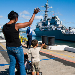 Image of a family watching departing Sailors