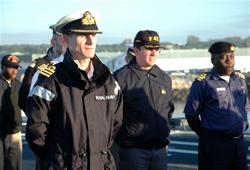 USS NASHVILLE, Rota, Spain - British Royal Navy Commander Mark Fitzsimmons, director of staff for Africa Partnership Station (APS) Nashville, stands by with multinational APS partners as Vice Admiral Bruce W. Clingan, commander of U.S. 6th Fleet, addresses the crew of USS Nashville (LPD 13) during the ship's visit to Rota, Spain, January 28, 2009. Nashville is deployed as a part of APS, an international initiative developed by Naval Forces Europe and Naval Forces Africa, which aims to work cooperatively with U.S. and international partners to improve maritime safety and security in West and Central Africa. (U.S. Navy photo by Petty Officer 2nd Class David Holmes) 