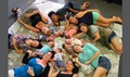 The first Tripler Army Medical Center Centering Pregnancy program mothers and babies pose for a photo during a special reunion. (U.S. Army photo by Spc. Paxton Busch)