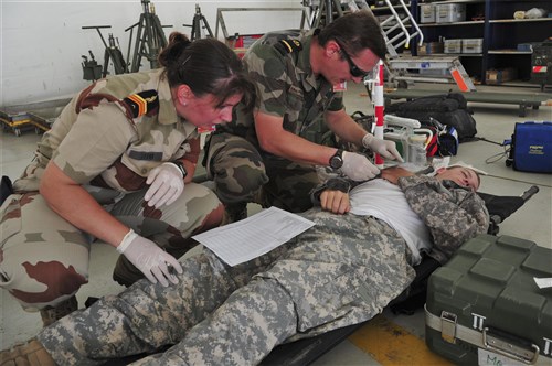 FRENCH FORCES DJIBOUTI, Djibouti (Sept. 25, 2012) - U.S. Army soldier is examined by French medical personnel at the simulated triage site on French Forces Djibouti base, Djibouti, Sept. 25, 2012, during a mass casualty exercise involving French and U.S. military forces. The exercise followed a fictitious storyline, but called for the employment of real-world assets. While French and U.S. forces conduct frequent combined training events, this was the first exercise of this type between the two nations in Djibouti.  The U.S. forces involved are assigned to Combined Joint Task Force - Horn of Africa, or CJTF-HOA. CJTF-HOA works with coalition partners, such as the French, and with countries in East Africa to promote regional security and stability. (U.S. Air Force photo by Technical Sergeant Donald R. Allen)