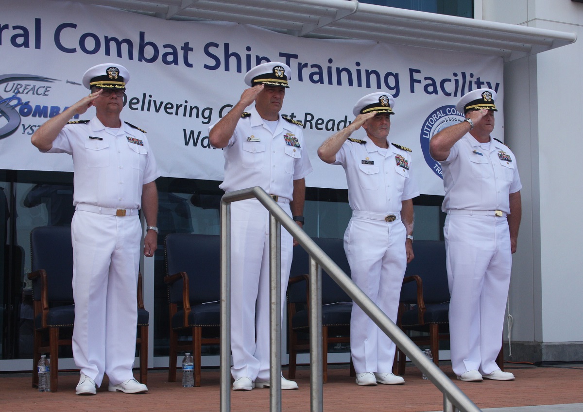 SAN DIEGO (September 22, 2016) Left to right:  Cmdr. Michael Phillips, Training Support Center San Diego Command’s chaplain, Capt. Bill McKinley, Center for Surface Combat Systems commanding officer, Capt. E. Scott Pratt, Program Executive Office Littoral Combat Ship's (PEO LCS) Fleet Introduction and Sustainment program manager (PMS 505), and Capt. Ron Toland, Fleet Anti-Submarine Warfare Training Center's (FLEASWTRACEN) salute during colors at the ribbon cutting ceremony for the new  Littoral Combat Ship Training Facility (LTF), Building 3304, onboard Naval Base San Diego (NBSD).   U.S. Navy photo by Sonar Technician (Surface) 2nd Class Vaughn Hardge, Fleet Anti-Submarine Warfare Training Center / Released 