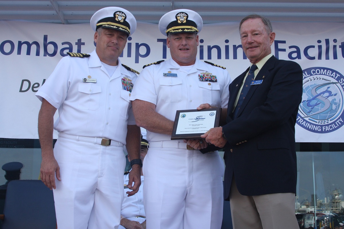 SAN DIEGO (September 22, 2016) Capt. Bill McKinley, Center for Surface Combat Systems commanding officer and Capt. Ron Toland, Fleet Anti-Submarine Warfare Training Center's (FLEASWTRACEN) commanding officer, provide a plaque  to Coronado  Council of the United States Navy League’s President retired Navy Capt. Glenn Welch, for the Coronado Council’s assistance with the ribbon cutting ceremony for the new  Littoral Combat Ship Training Facility (LTF), Building 3304, onboard Naval Base San Diego (NBSD).  U.S. Navy photo by Sonar Technician (Surface) 2nd Class Vaughn Hardge, Fleet Anti-Submarine Warfare Training Center / Released 