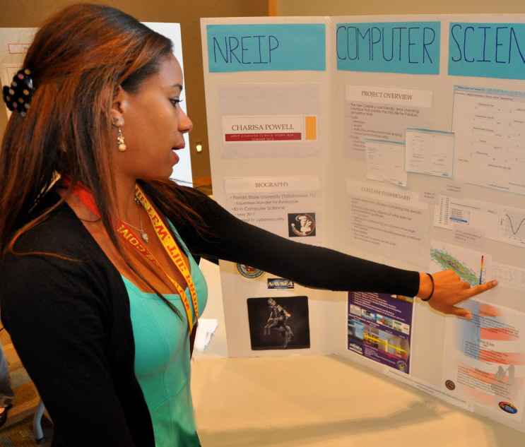 DAHLGREN, Va. - Florida State University student Charisa Powell presents her research on the "Development of Software Tools for Simulation Prototypes" to military and government personnel during her 2016 summer internship. Powell — among 22 students who completed their internships at Naval Surface Warfare Center Dahlgren Division (NSWCDD) — is working towards a bachelor's degree in computer science. The Naval Research Enterprise Intern Program (NREIP) encourages students to pursue science and engineering careers, furthers education via mentoring and their participation in research, and makes them aware of Navy research and technology efforts, which can lead to civilian employment within the Navy. U.S. Navy Photos by John Joyce/Released