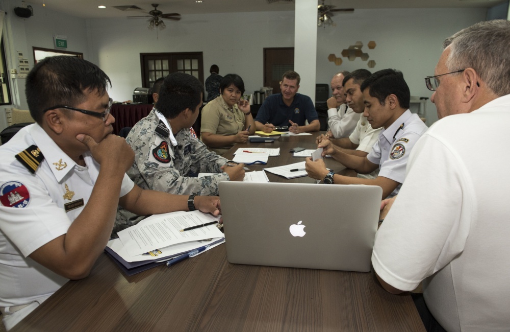 SINGAPORE (Aug. 19, 2016) Liaison officers from participating countries of Southeast Asia Cooperation and Training (SEACAT) 2016 review a training brief to prepare for the exercise at Yankee Station, Aug. 19. SEACAT is multilateral exercise held annually with nine participating countries including the United States, Brunei, Indonesia, Malaysia, the Philippines, Cambodia, Bangladesh, Singapore, and Thailand.  U.S. Navy photo by Mass Communication Specialist 2nd Class Joshua Fulton/Released 